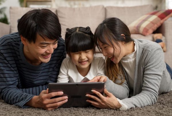 Asian Family watching online video content