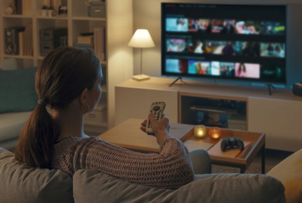 woman at home watching TV
