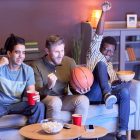 Men at home watching a basketball game