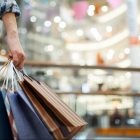 Woman holding shopping bags in the mall