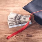 Graduation cap and dollars