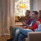 young viewers watching tv and on their phones