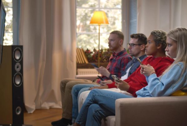 young viewers watching tv and on their phones