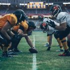 Football players in game on field