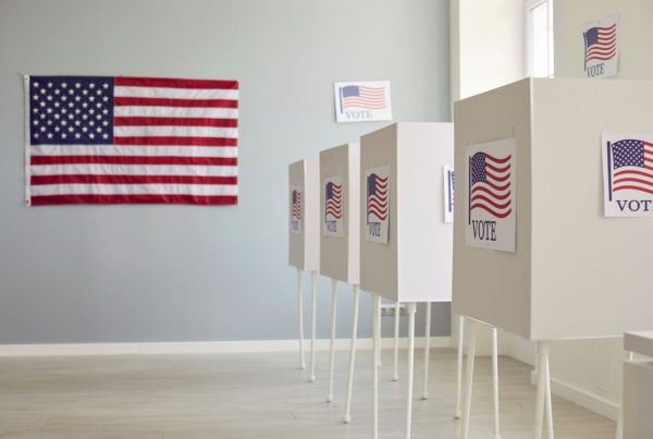 U.S political voting booths with USA flags